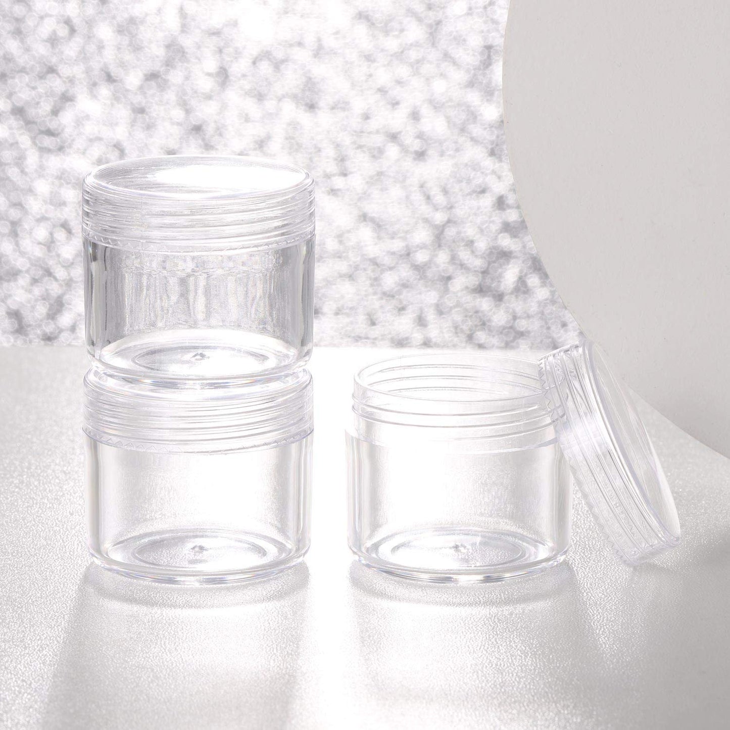 Refillable Cosmetic Sample Jars - 100 Pack 20g (0.7oz) Clear Small Travel Containers with Lids + 10 Mini Makeup Spatulas - BPA Free